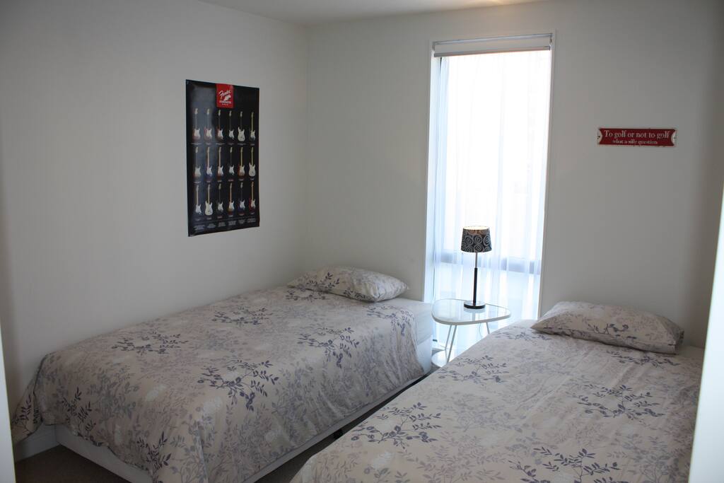 The 2nd bedroom with 2 king single beds