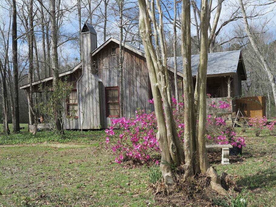 Vintage cypress salvaged from New Orleans warehouses make this modern built cabin (2003) fit perfectly with the historic homes of St. Francisville and the English plantation homes built in the 1800's.