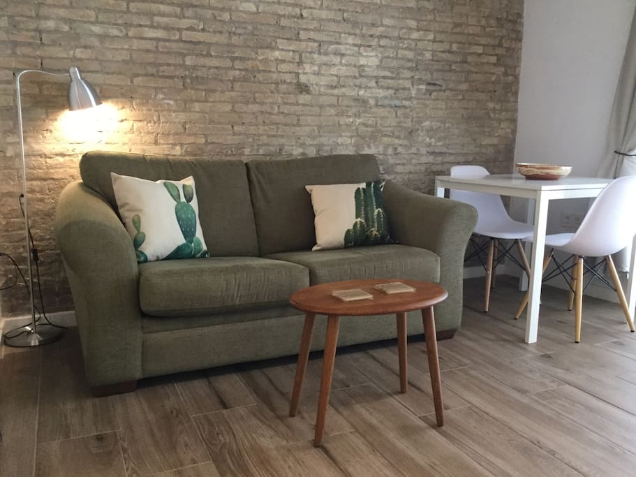Lounge area with comfy sofa (which converts to a bed).