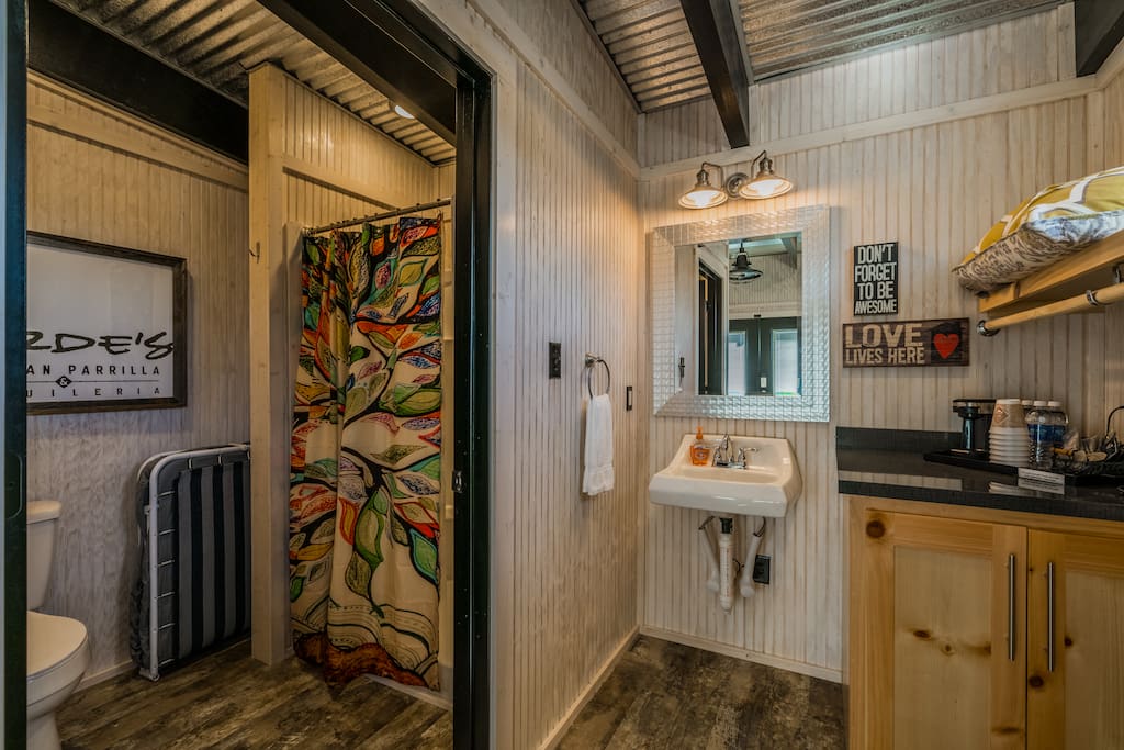 Full bathroom with shower and separate sink and closet area. (See fold-up Twin Cot in the corner near shower.)