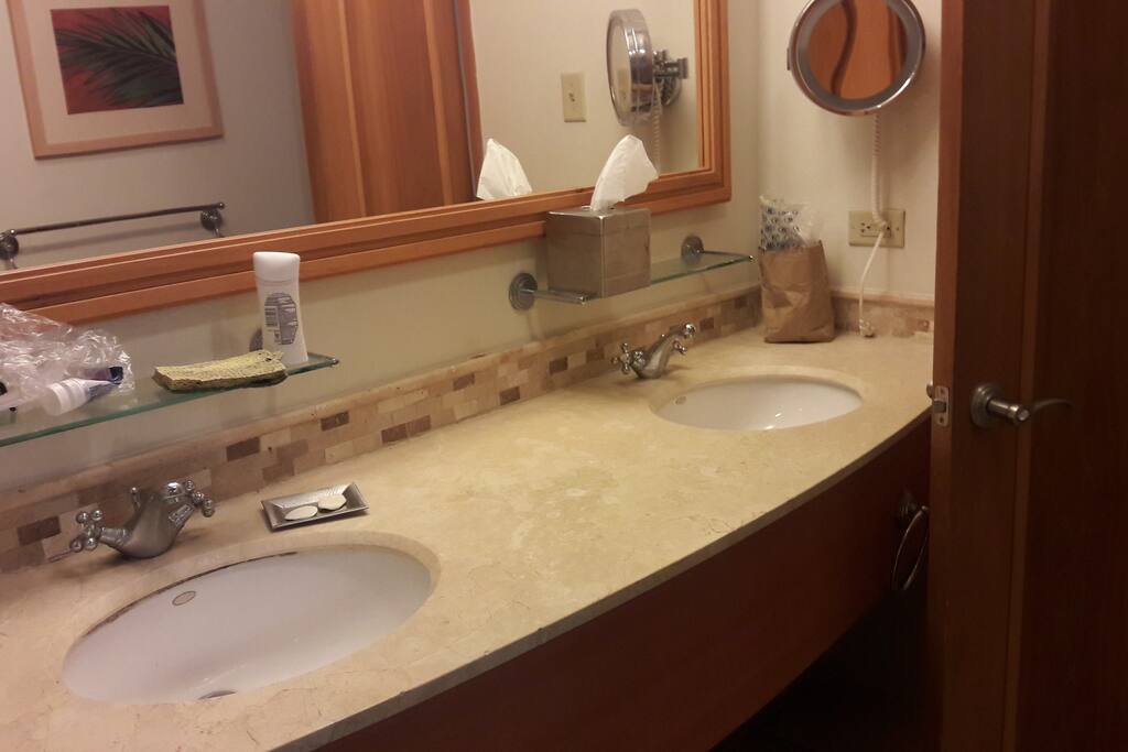 Bathroom with marble top wash basins.
