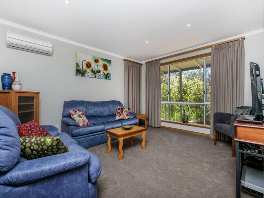 Lounge room with 30 inch TV, DVD player & DVD's