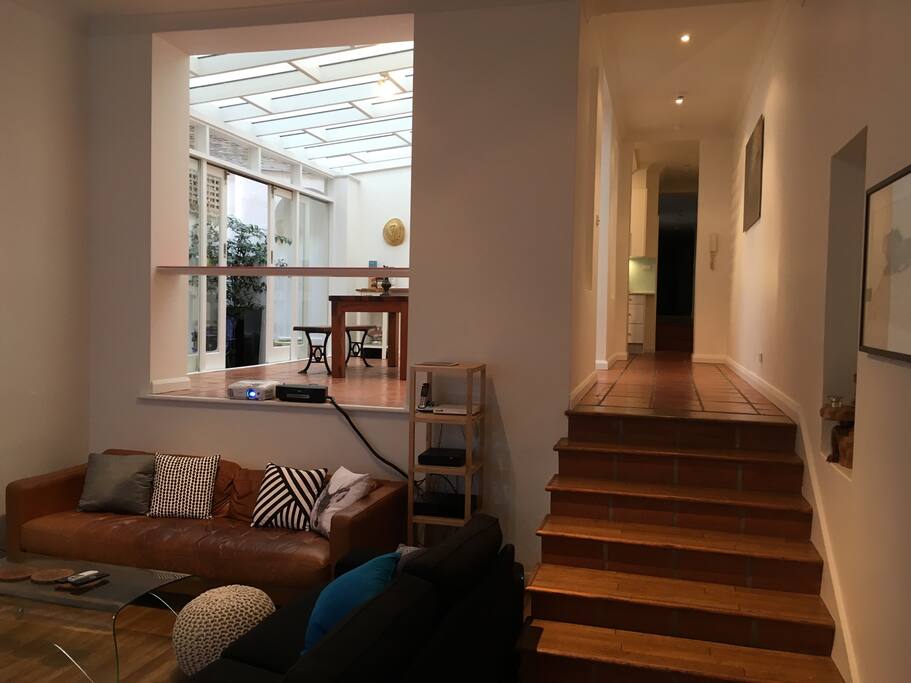 Sitting room leading up steps to conservatory/dining room