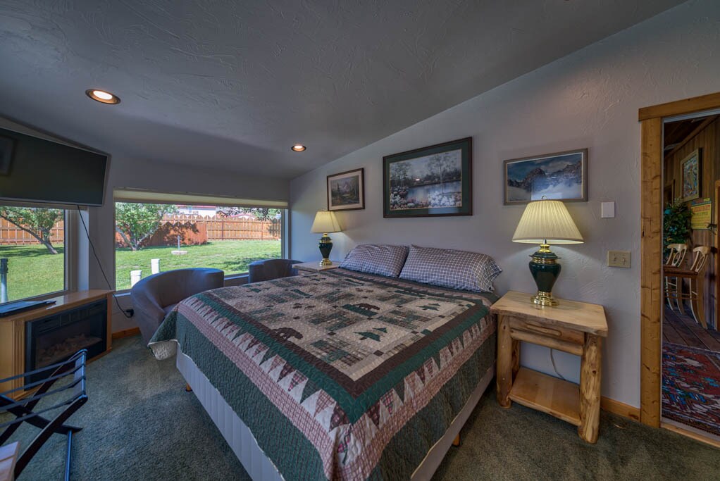 Bedroom 1- Pool side bedroom with a king bed