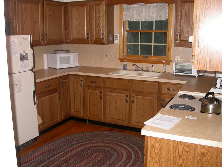 Immaculate kitchen well equipped with pots, pans, utensils...