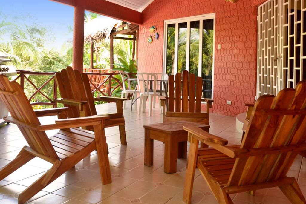 Pink Villa Varanda with teak beach chair and table for four