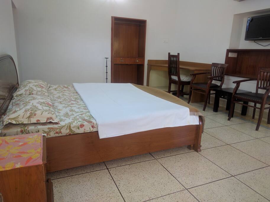 Another view of the bedroom with the sitting area