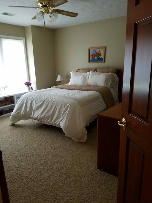 Large queen size bed in bedroom 1.