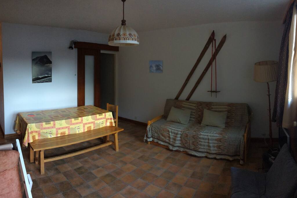 Kitchen is on the far right and bedrooms are to the left at the end of the corridor