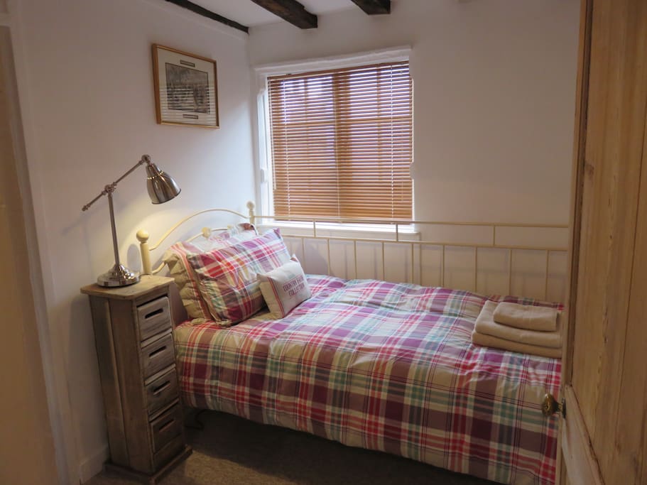 Single bedroom with built in wardrobe & door to family bathroom.