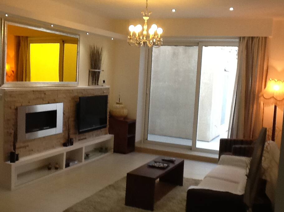 Sitting area with TV and fireplace.