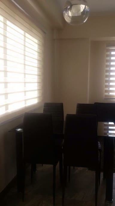 Sliding Window with blinds, dining table (pic was taken in the morning; doors closed)
