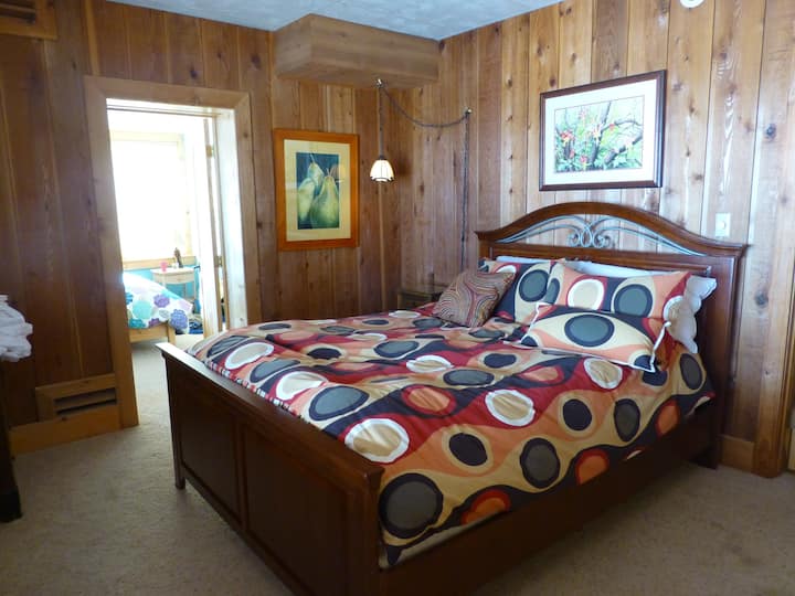 Cedar Room with one queen bed and valley view.