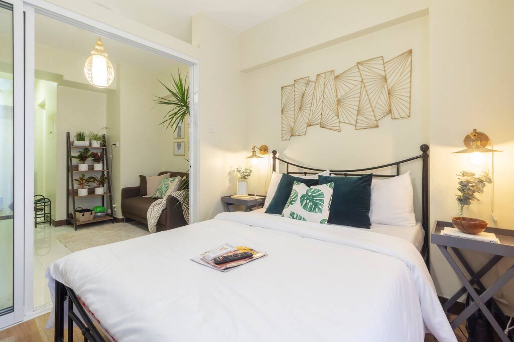 A very cozy bedroom angular shot from the balcony’s glass door that can cleanse your stress from the outside world.