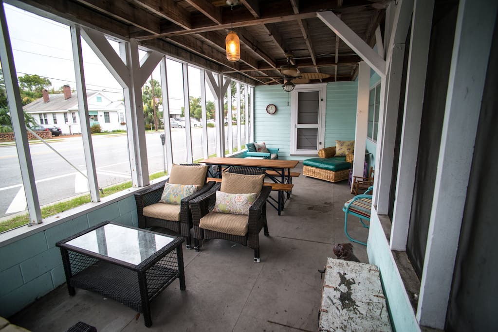 Entrance to unit through screened porch with lots of seating.