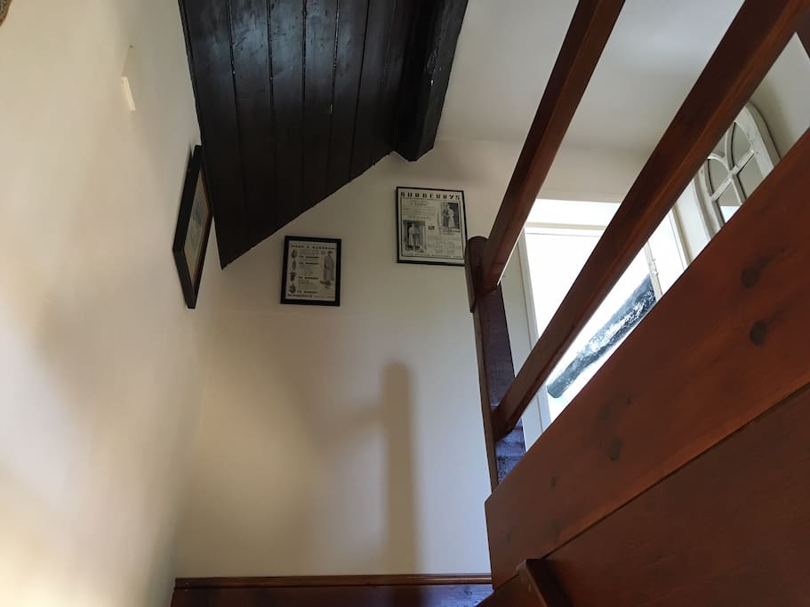 Looking upstairs. Beams throughout