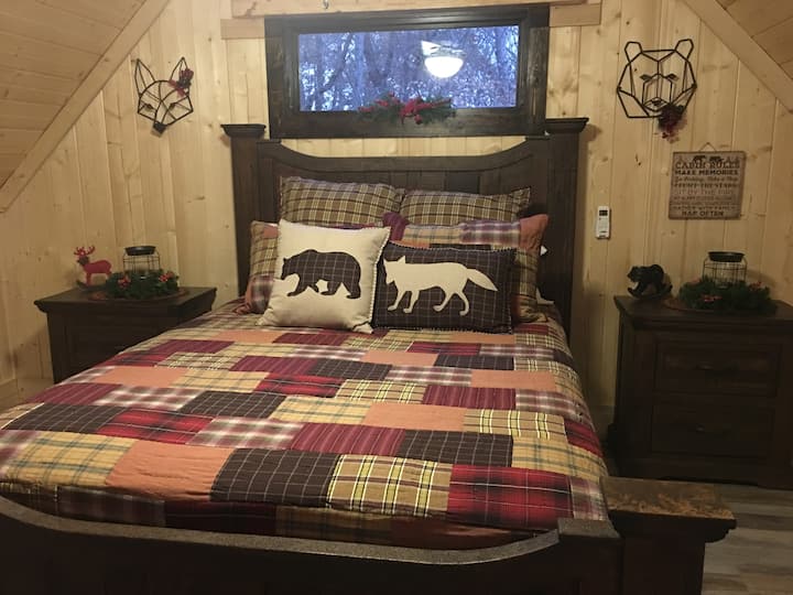 This queen size bed is located in the loft area. 