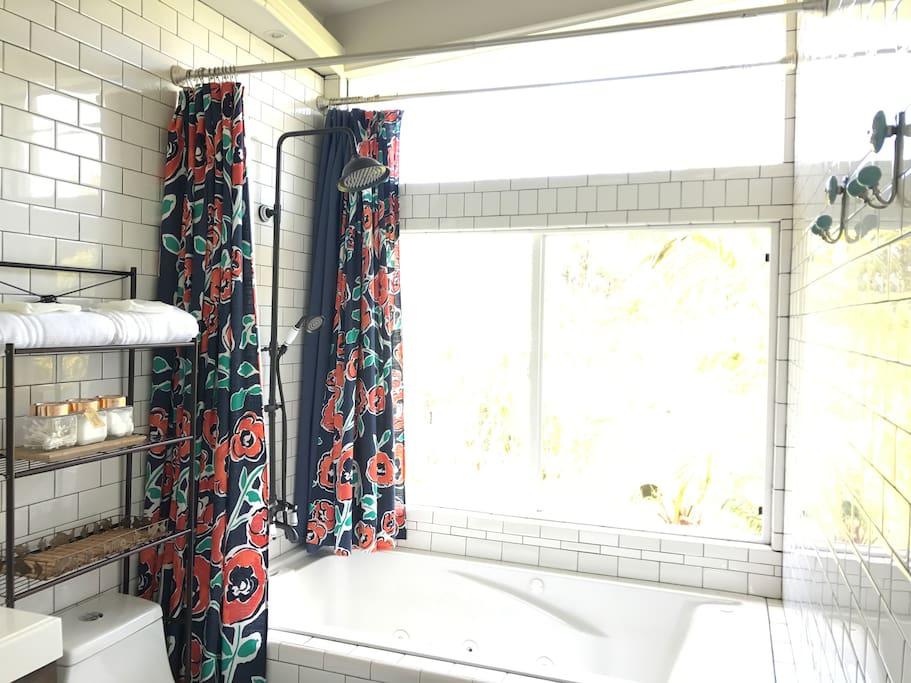 Enjoy the 6ft jacuzzi bathtub with large shower head and large windows - it feels like you're taking a bath/shower in the jungle. Bath salts and bubble bath soap provided.