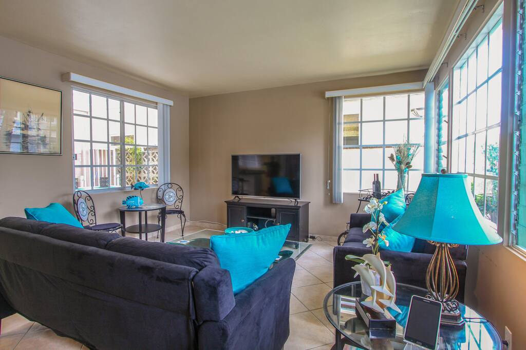 Seating for 5 and a 55" TV in the window-lined living room. Stream on your own devices, too, with complimentary Wi-Fi.