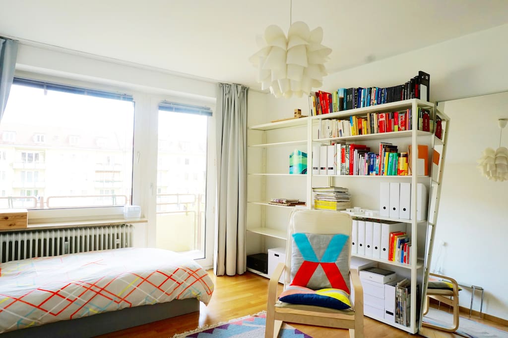 The furniture & decor has some bright colored items that transform the apartment into a cozy home.
