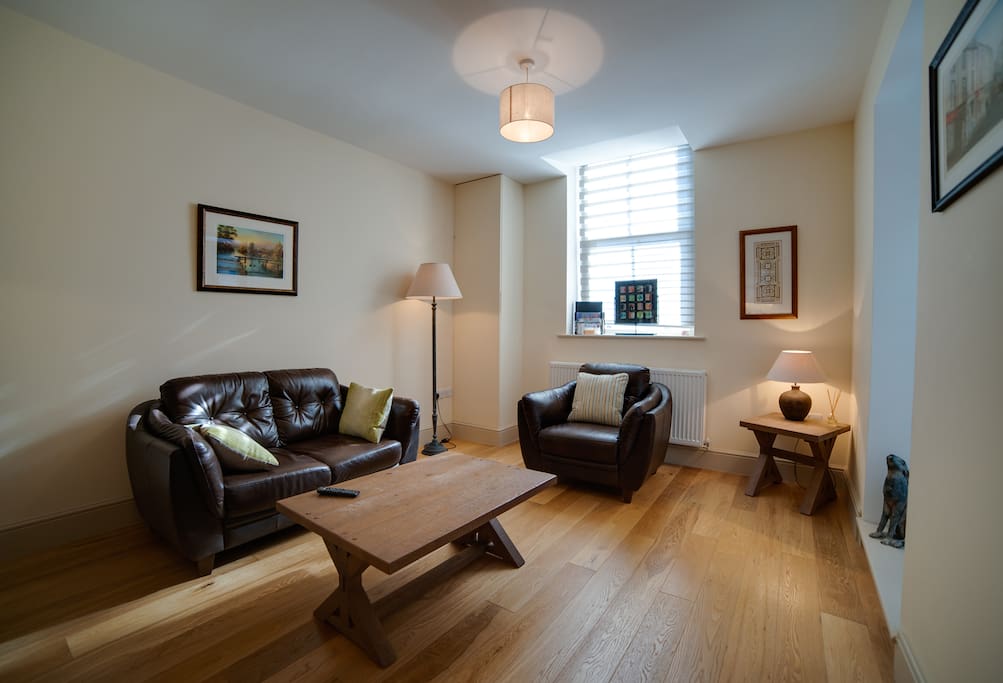 Beautifully furnished living area with local artwork on the walls.
