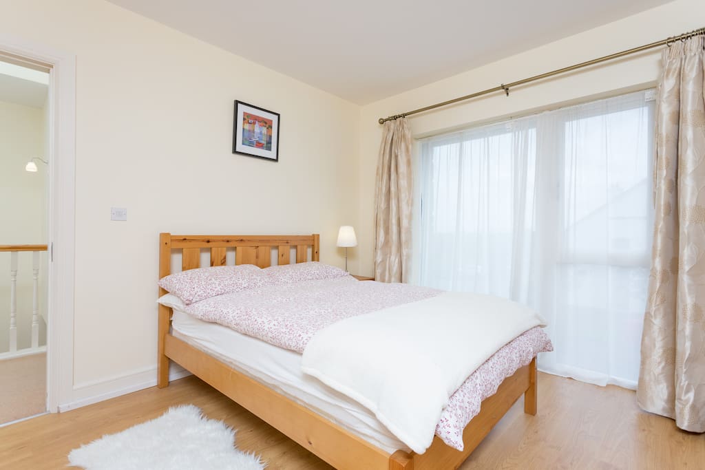 A comfortable double bed awaits in this room for two