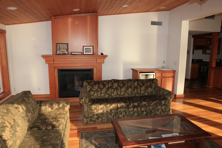 Relax with friends around the coffee table while the gas fireplace gently warms your evening.