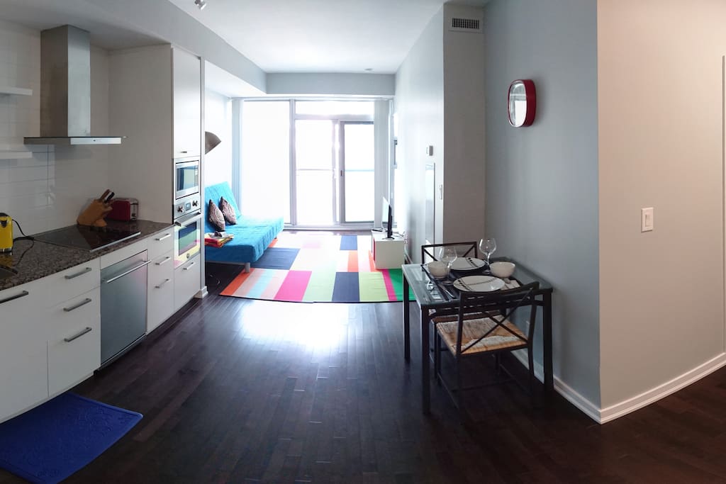 Open Kitchen and Living Room Space with Floor to Ceiling Windows