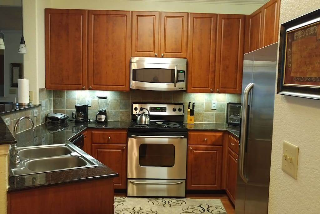 Spacious kitchen with plenty of cabinet space. Stainless steel appliances.