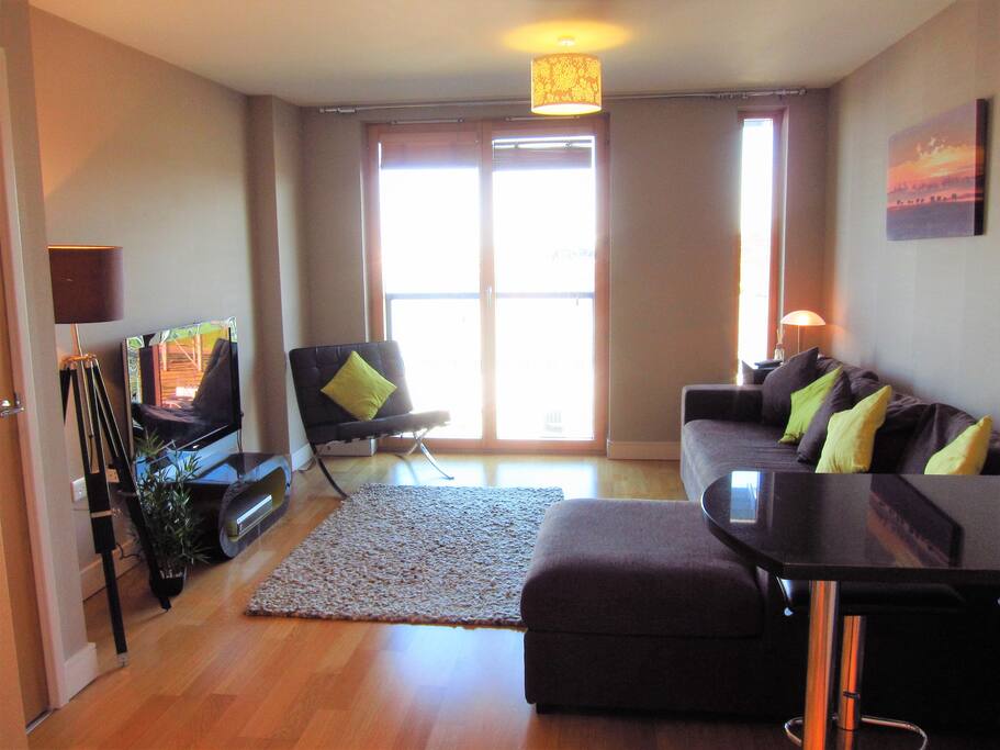 Living room with river views and large sofa-bed