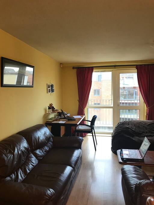 Living room with balcony and view to the Top of Saint Patricks Cathedral
