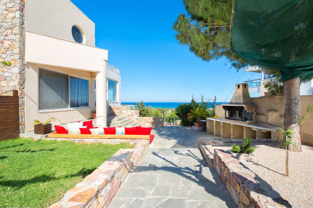 Your private garden with grass, big BBQ and sea view