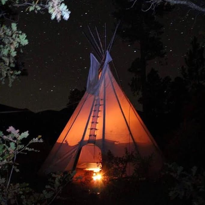 With a fire burning the tipi has a nostalgic feeling on a summer night