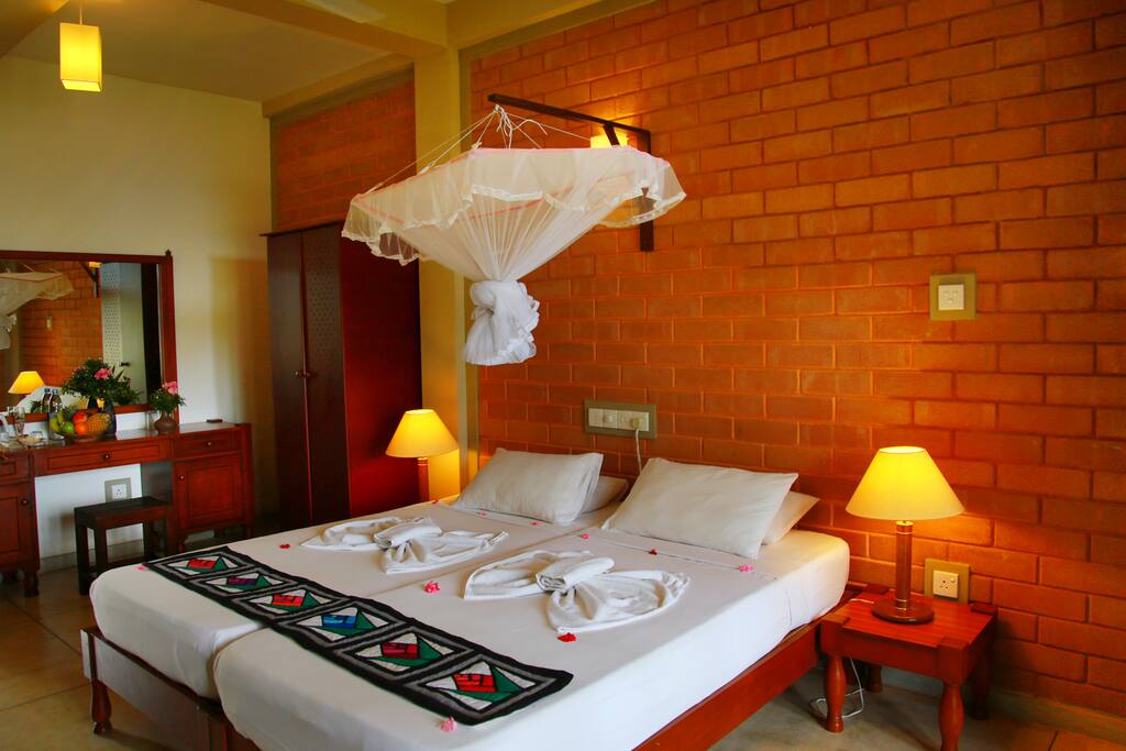 Ground floor twin room with sea/pool view.