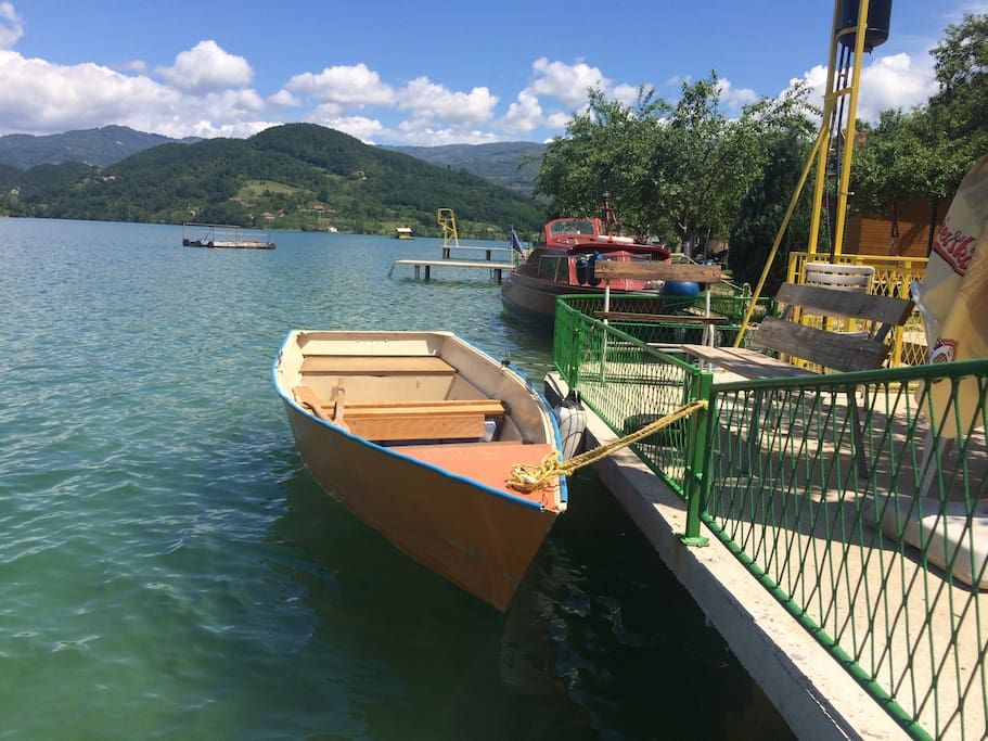Area outside, old boat which can be used on the lake if available.