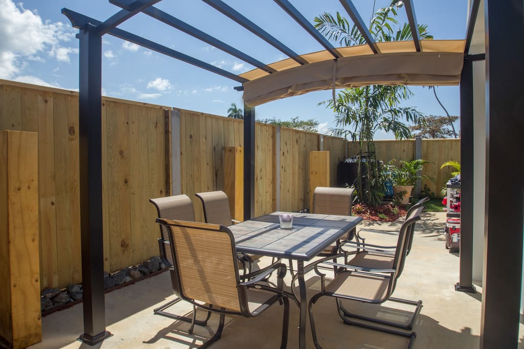Private Back Patio- Table, chairs and pergola.