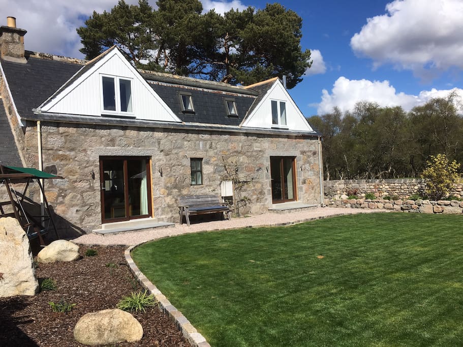The rear of the cottage showing the enclosed garden