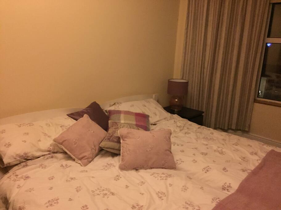 Lovely large bedroom with twin beds. The room has big bay windows and black out blinds. There is a TV and DVD player in the room but also access to kitchen, bathroom and lounge