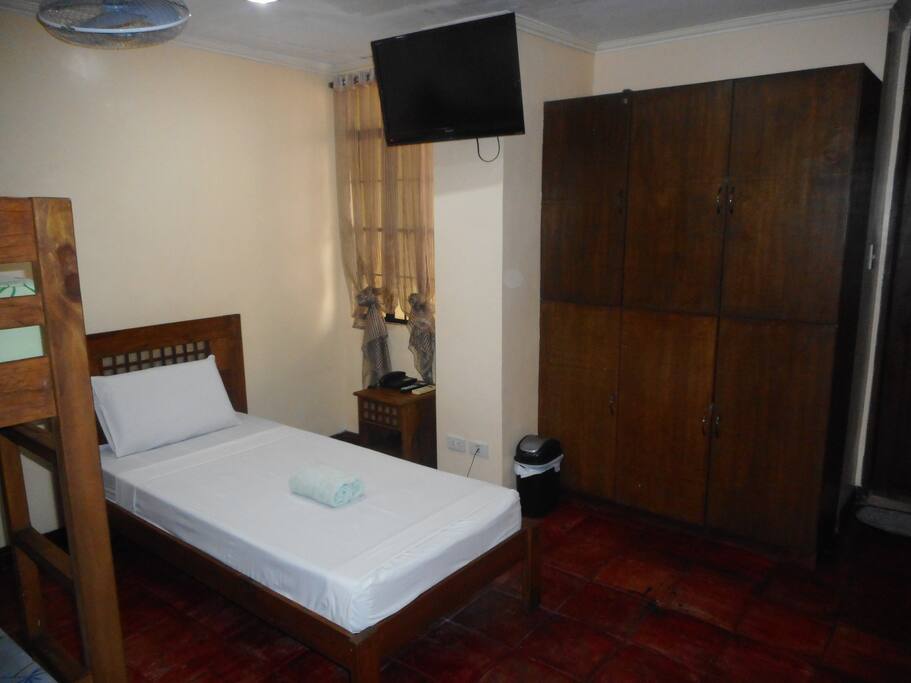 Flat screen TV and ample cupboard storage