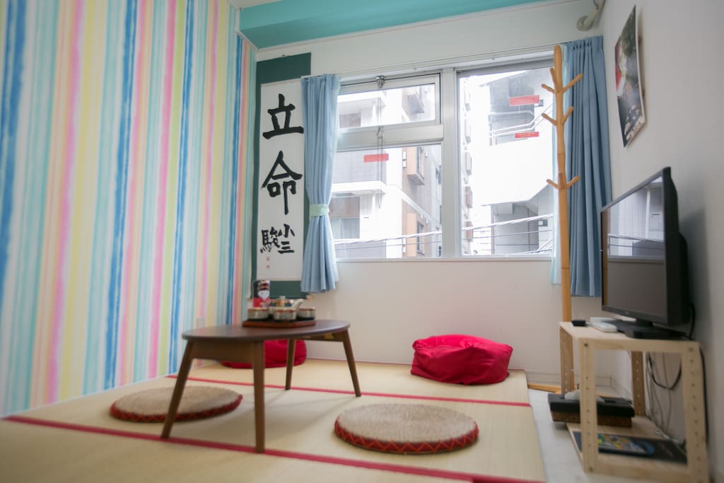 futon packed away, showing the tatami and TV - bedroom 3/living room