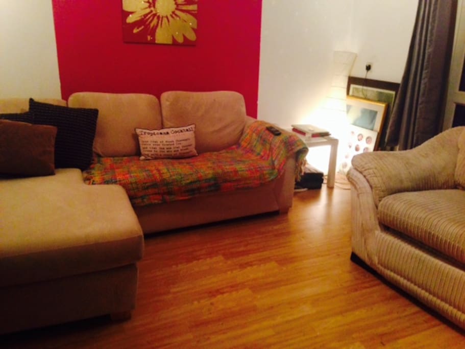 Lovely lounge with balcony, TV, wall mounted fire and very comfy double sofa bed
