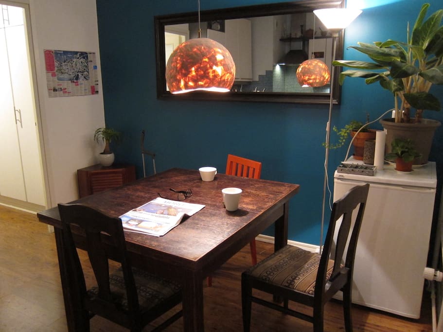 Spacious kitchen with aquamarine wall