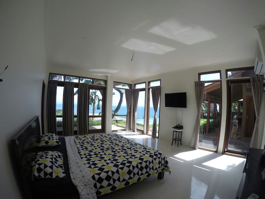 the room looking out to the pool and the ocean