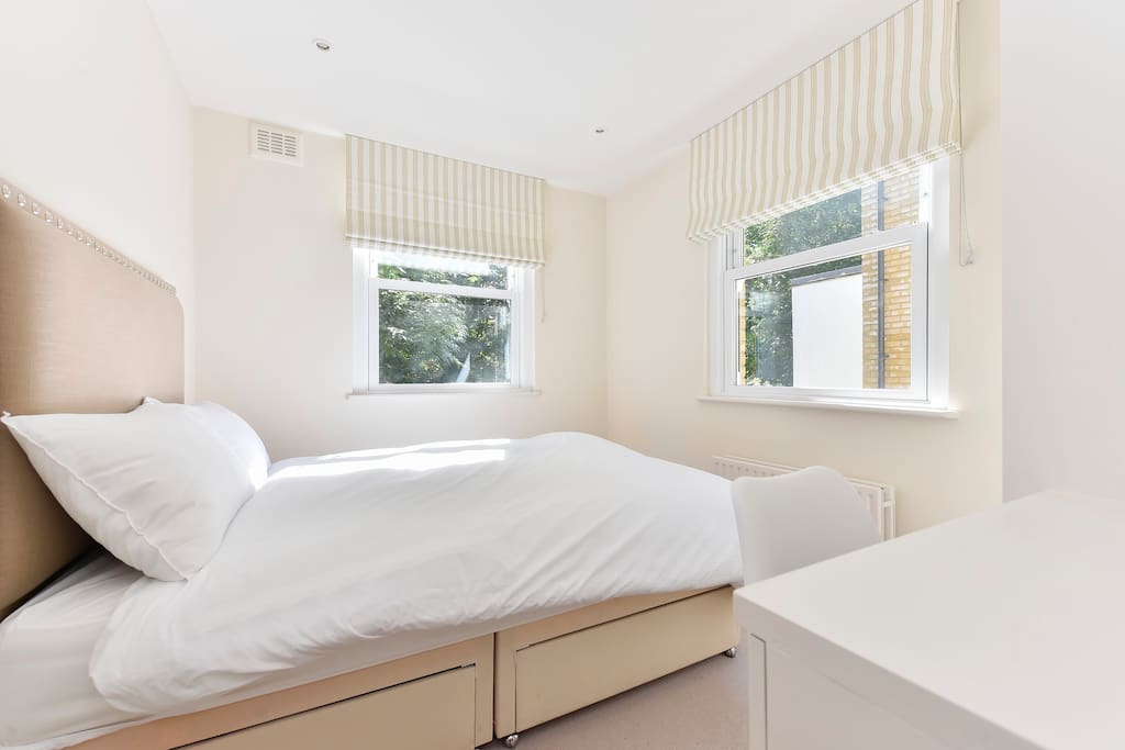 Bedroom 1 has two large windows, comfy double bed, ensuite bathroom and dressing table.