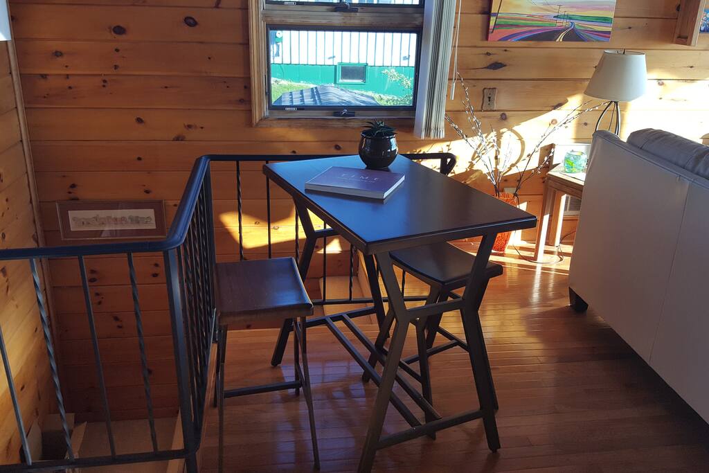 Main floor living space next to stairs to the lower level