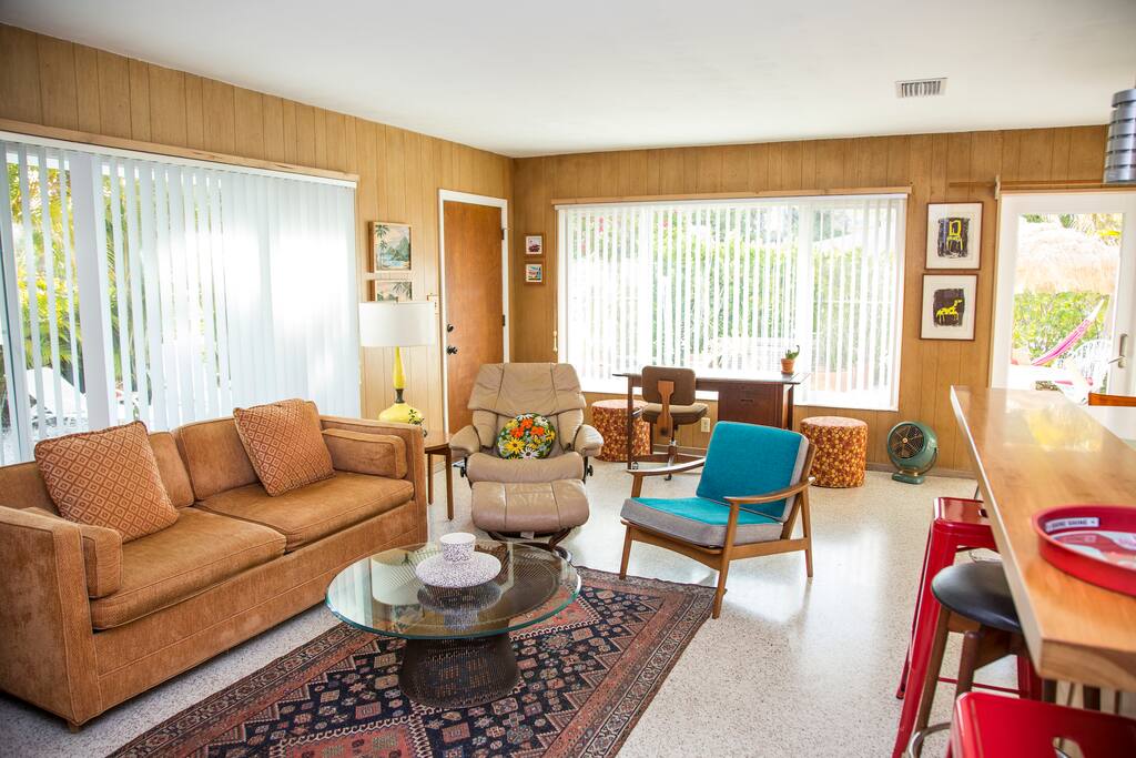 Living room with tons of light looking out onto garden and private patio.