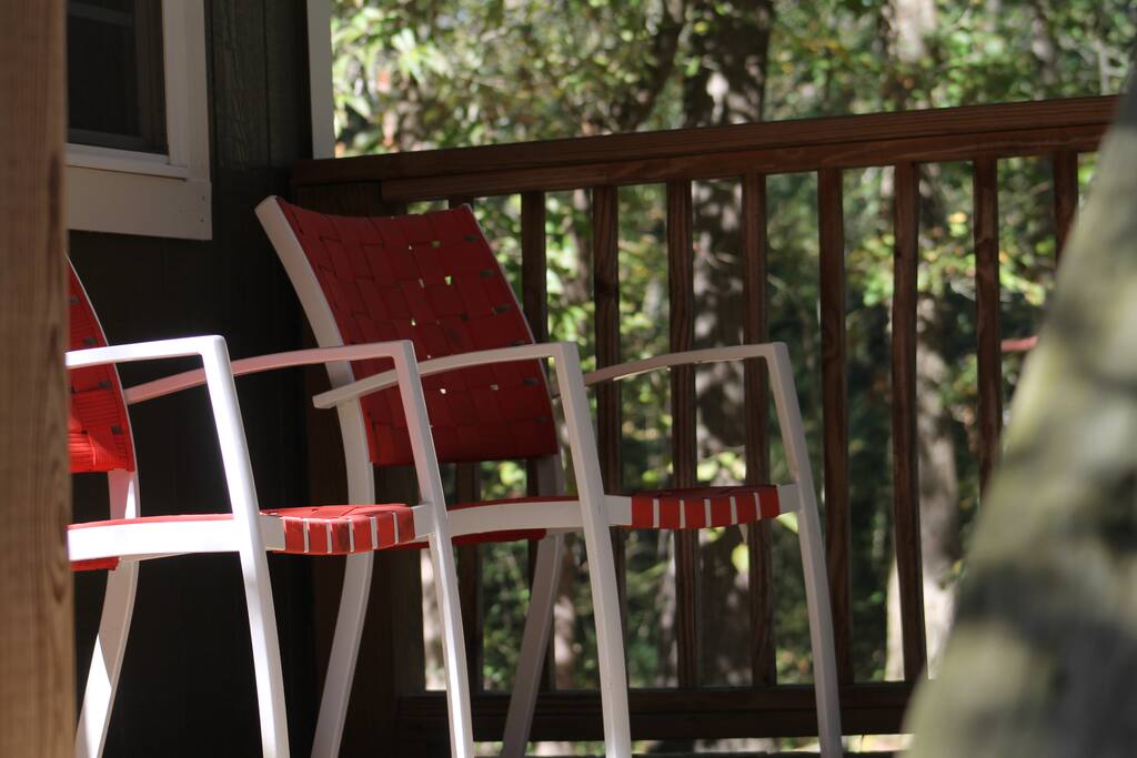 A covered, cozy and quiet front porch with seating for 4.