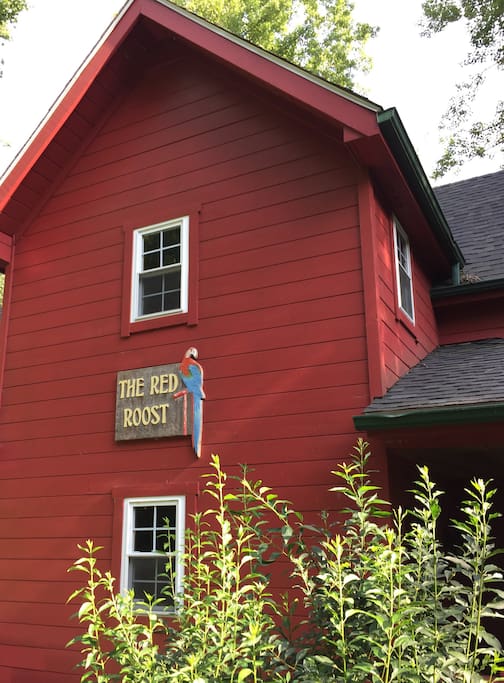 Front of house. Red Roost sign visible from the street.