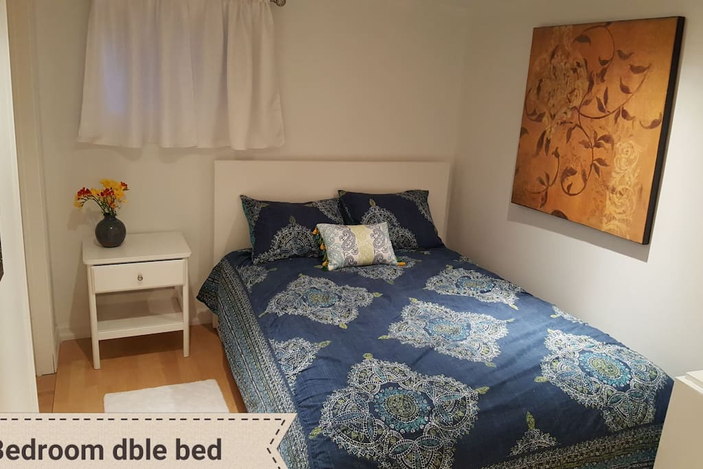 Double bed bedroom includes dresser and large closet