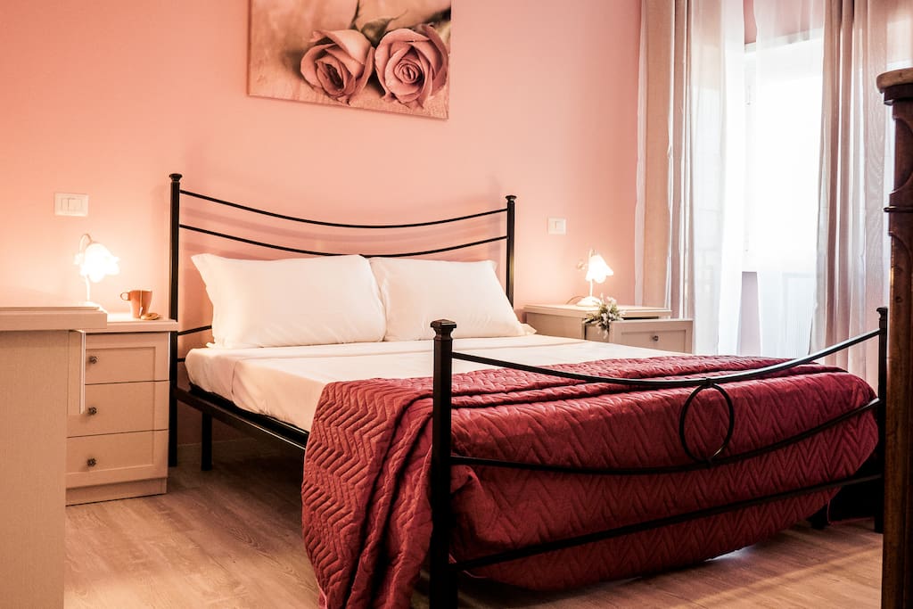The pink bedroom with a double bed